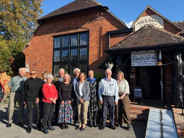 Councillors, trustees and volunteers outside Goodworth Clatford Village Club at the reopening on 16 October